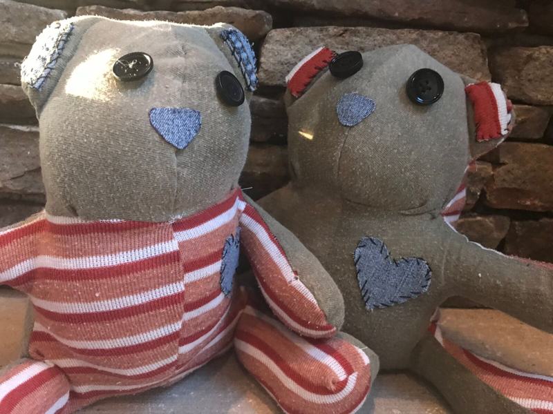 Two memory bears sewn from a mother's striped shirt with denim hearts