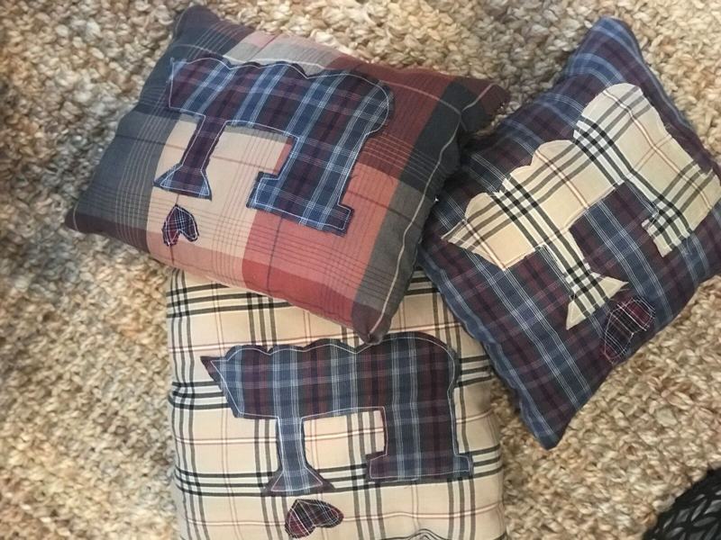 Train appliqué pillows made from plaid shirts