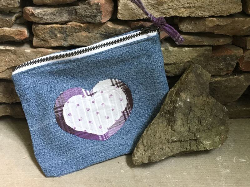 Denim zipper pouch with plaid heart appliqué