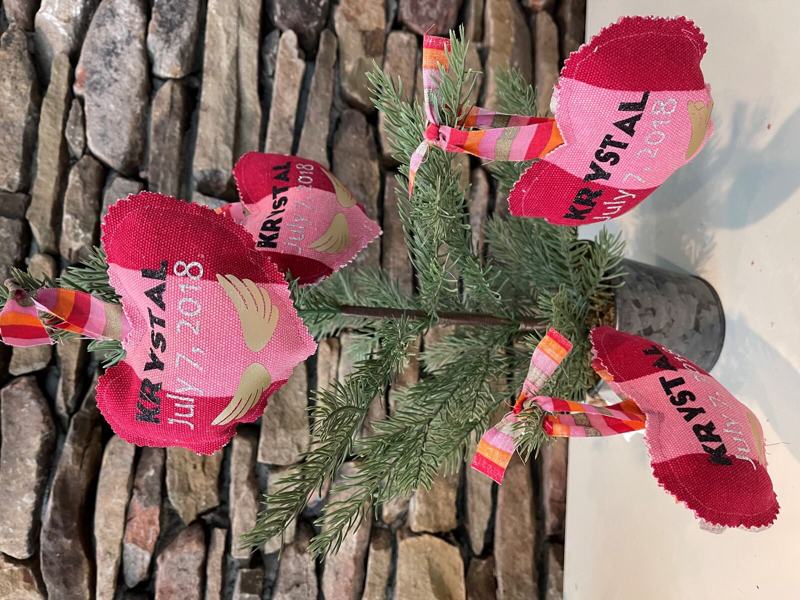 Pink keepsake ornaments on a tree