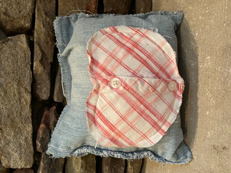 Mini pillow with heart made from a mother's clothing