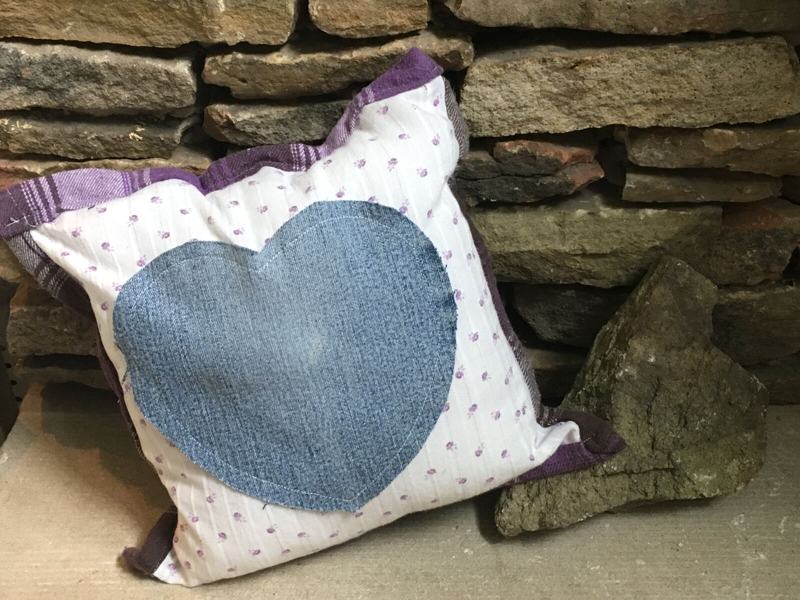 White polka dot pillow with large denim heart