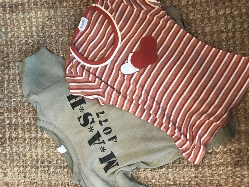 A striped shirt being turned into keepsakes with a heart appliqué