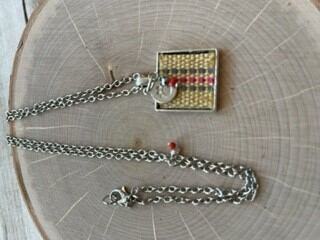 Square pendant necklace made with a woven dog collar inlay